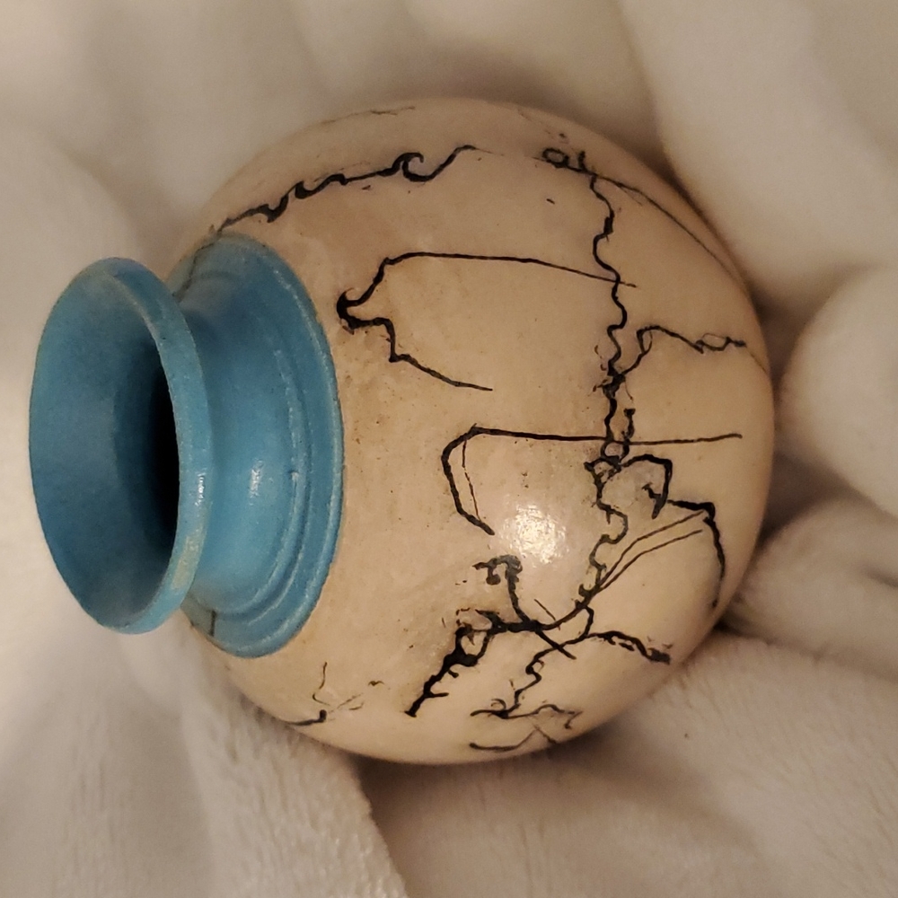 Ceramic horse hair piece.